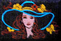 Lady with blue hat. Embroidery by Cool Creations